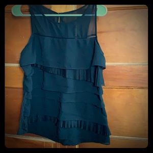 Express sleeveless top with ruffles.